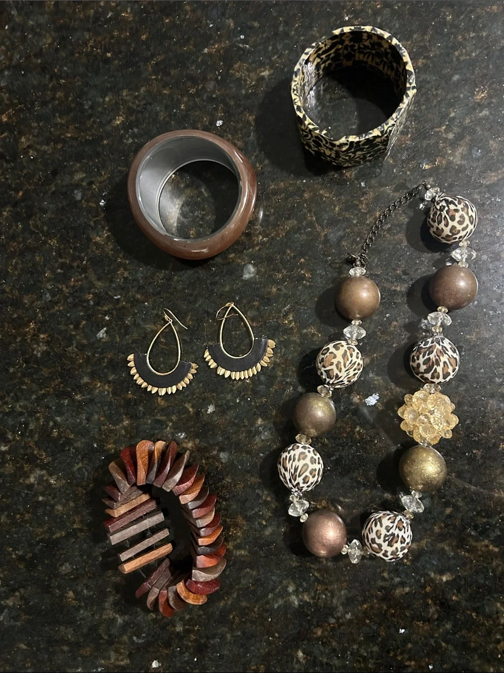 3 bracelets 1 necklace and 1 pair of earrings